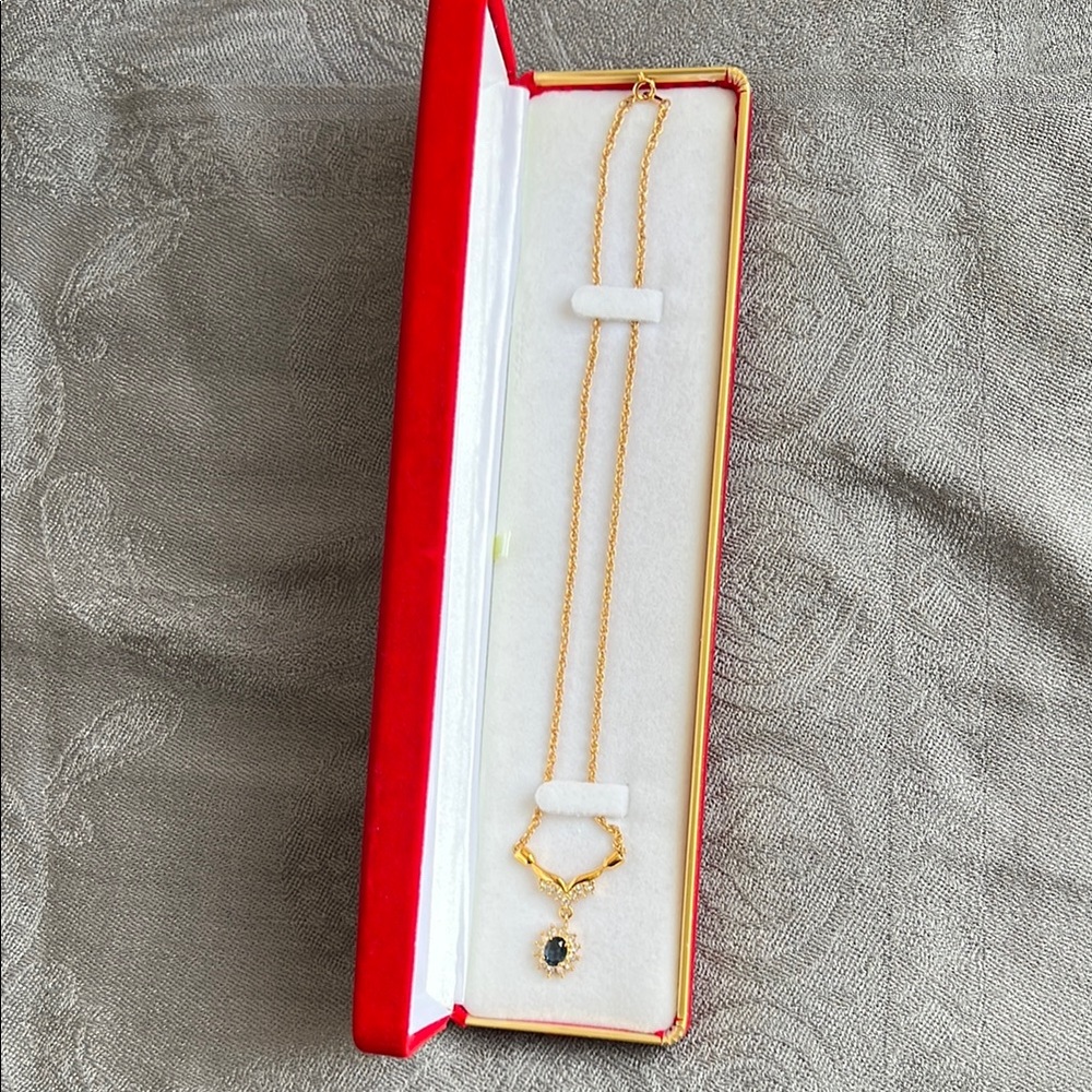 Elegant Gold Necklace with Blue Pendant